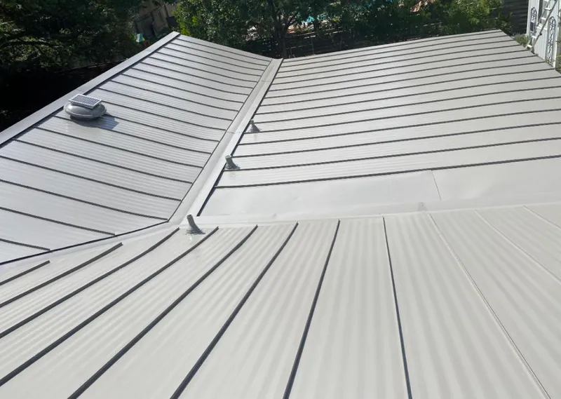 Solar attic fan installed on a metal roof for Roof Ventilation in Muscoy